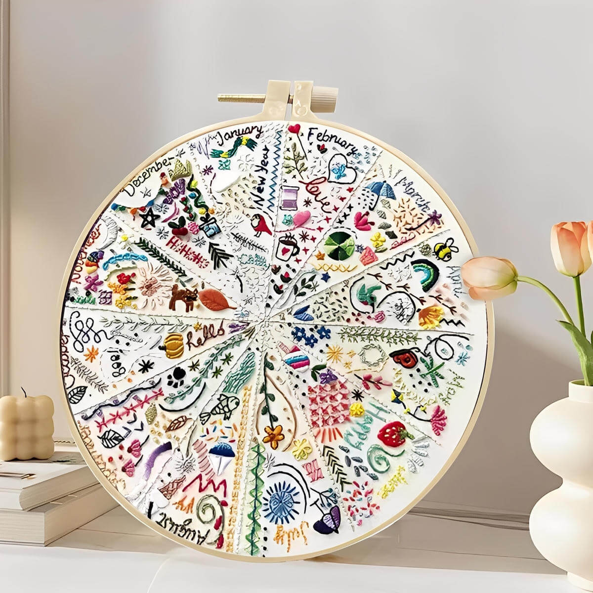 CraftHoop Advent of 12 Seasons Embroidery Kit showcasing vibrant circular design with seasonal scenes.