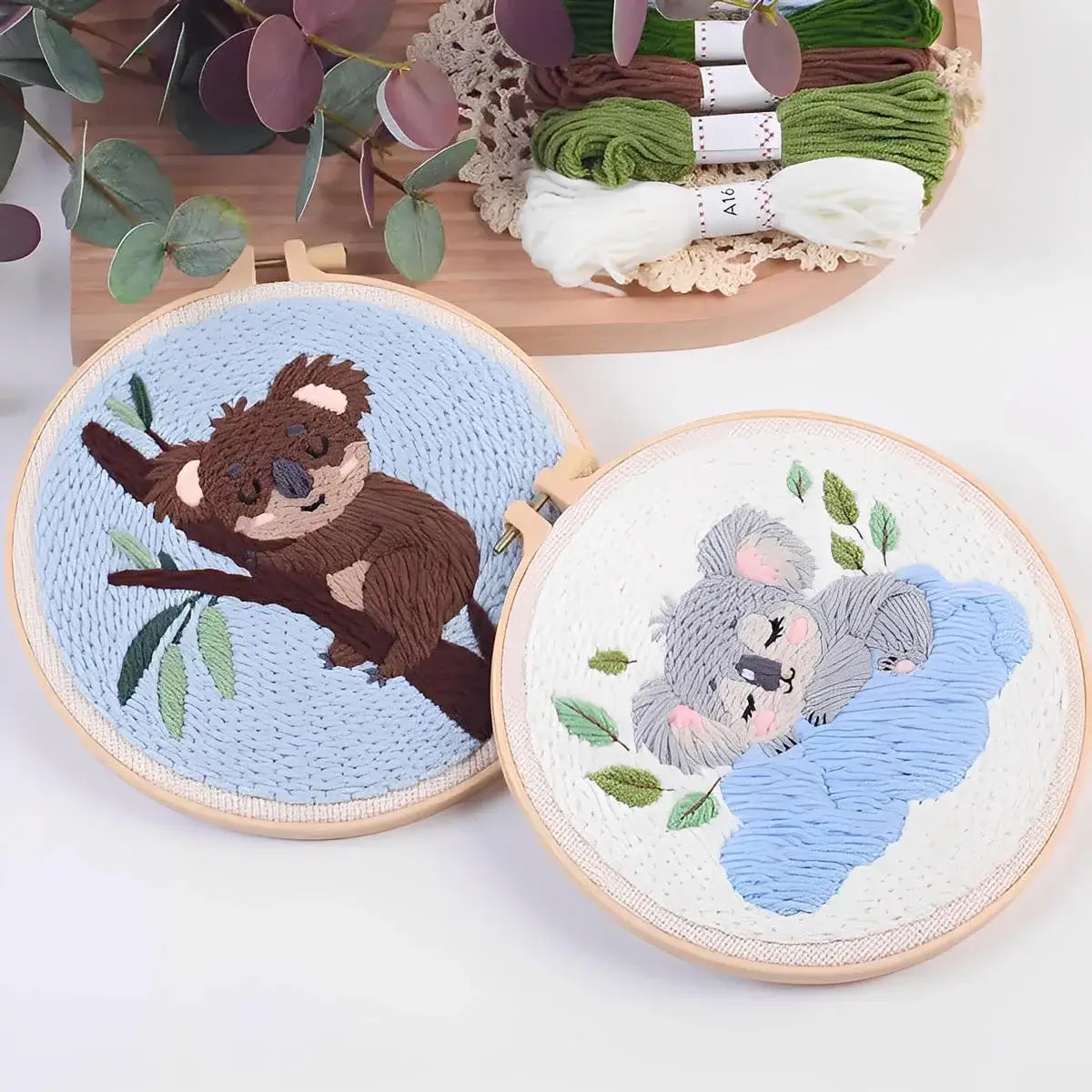 CraftHoop Cozy Koalas Punch Needle Kit featuring two colorful koala designs on embroidered hoops.