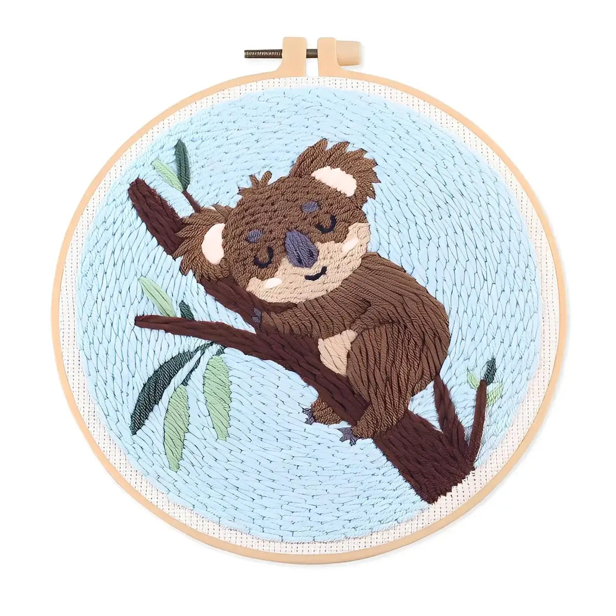 CraftHoop Cozy Koalas Punch Needle Kit featuring a cute koala embroidered on blue fabric.
