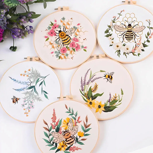 CraftHoop Bee & Bloom Embroidery Kit featuring floral designs and buzzing bees in vibrant hoops.
