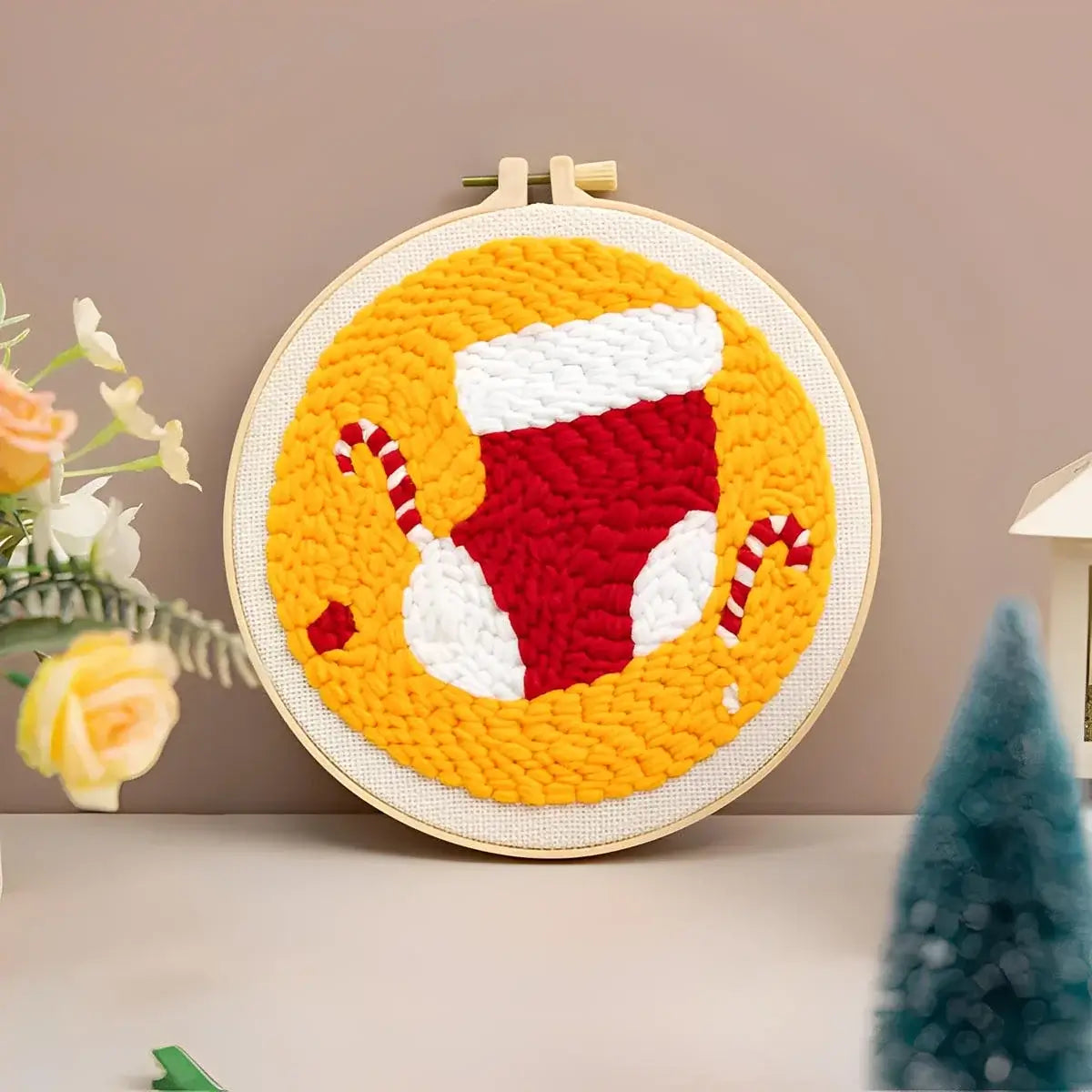 CraftHoop Christmas Cheer Punch Needle Kit festive stocking design with candy canes on a bright yellow background