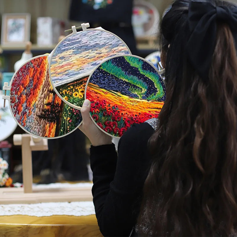 CraftHoop woman working on starry night landscape embroidery - Immersive and relaxing sewing experience