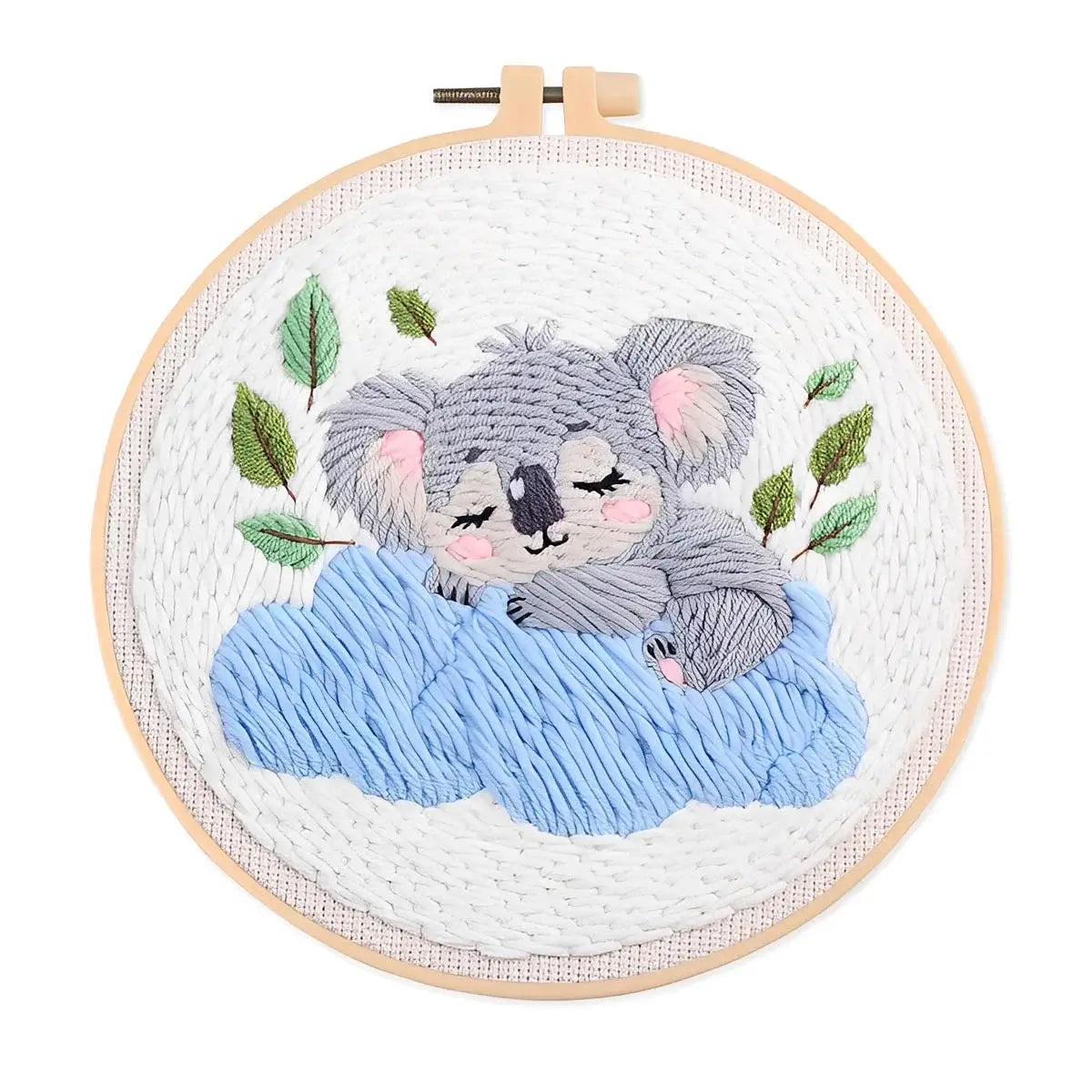CraftHoop Cozy Koalas Punch Needle Kit featuring a sleeping koala on a cloud with embroidered leaves.