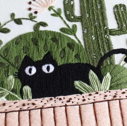 CraftHoop black cat peeking over potted plants embroidery - Fun and whimsical DIY sewing project