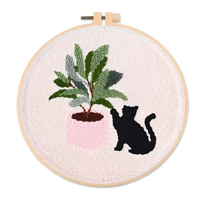 CraftHoop Cat & Plant Lovers Punch Needle Kit featuring a black cat and a potted plant in a circular embroidery hoop.
