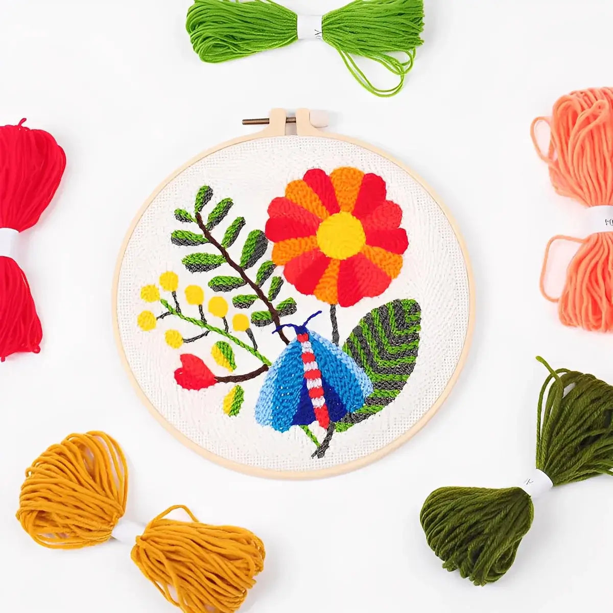 CraftHoop Garden Glow Punch Needle Kit with colorful yarns and vibrant floral design.