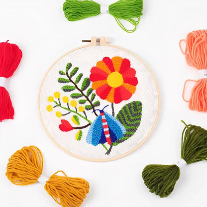 CraftHoop Garden Glow Punch Needle Kit with colorful yarns and vibrant floral design.
