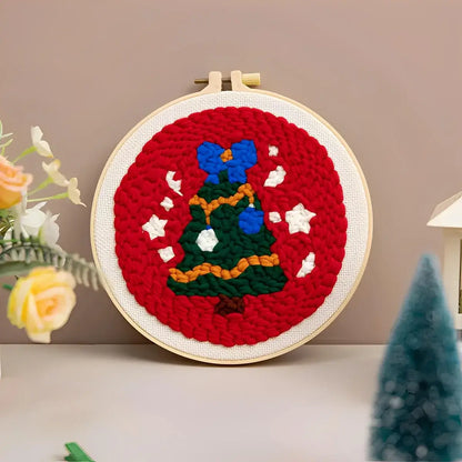 CraftHoop Christmas Cheer Punch Needle Kit featuring a festive Christmas tree design in a vibrant red hoop.