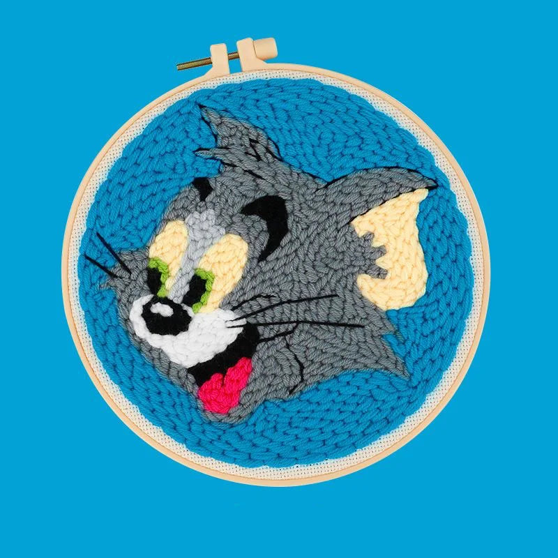 CraftHoop grey cat character embroidery on blue fabric - Classic and nostalgic DIY project