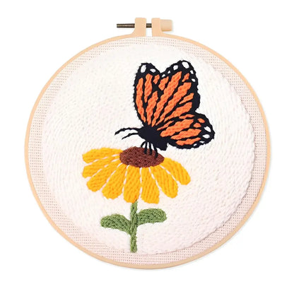 CraftHoop Buzz & Bloom Punch Needle Kit featuring a butterfly and flower design in a hoop.