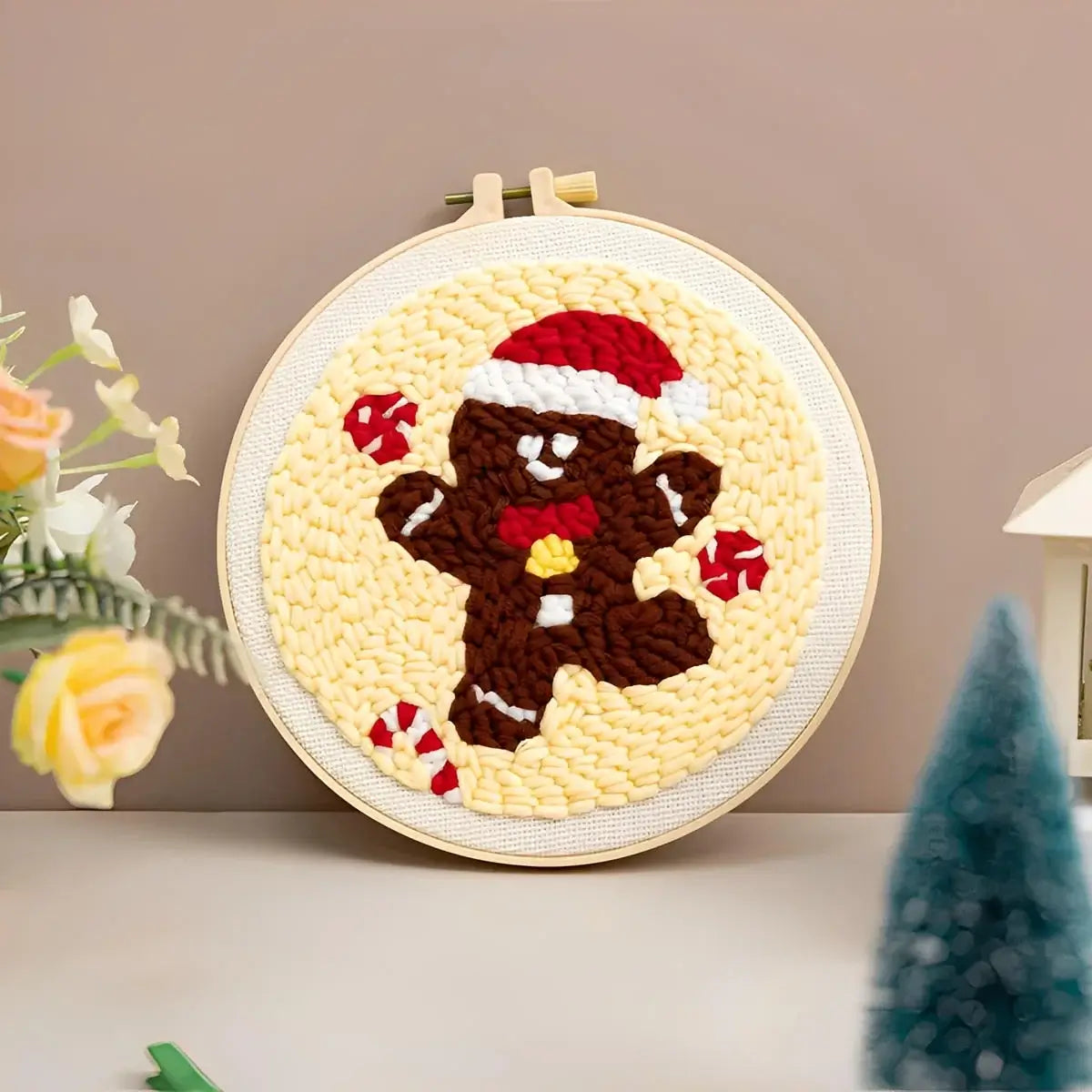 CraftHoop Christmas Cheer Punch Needle Kit gingerbread man design in festive colors on an embroidery hoop