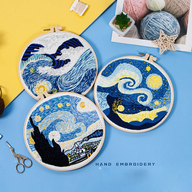 CraftHoop embroidery kit featuring a starry night design on blue fabric, inspired by Van Gogh's artwork, displayed on a wooden stand