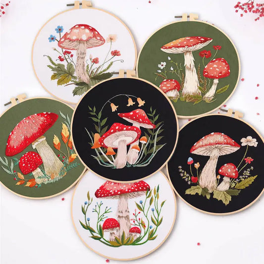 CraftHoop mushroom-themed embroidery set - A collection of intricate mushroom-themed embroidery designs displayed on different background colors.