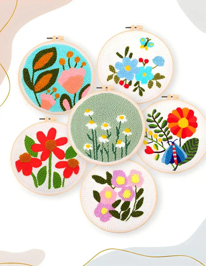 CraftHoop Garden Glow Punch Needle Kit featuring vibrant floral punch needle designs in an artistic display.