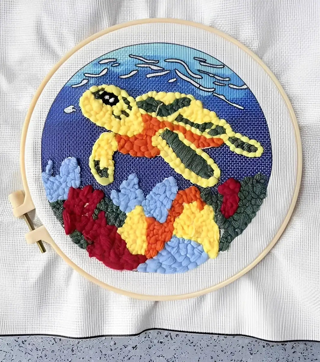 CraftHoop Farm Friends Punch Needle Kit featuring a vibrant sea turtle design in a wooden hoop.