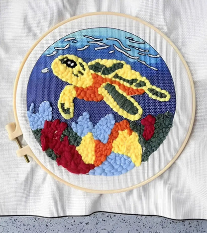 CraftHoop Farm Friends Punch Needle Kit featuring a vibrant sea turtle design in a wooden hoop.