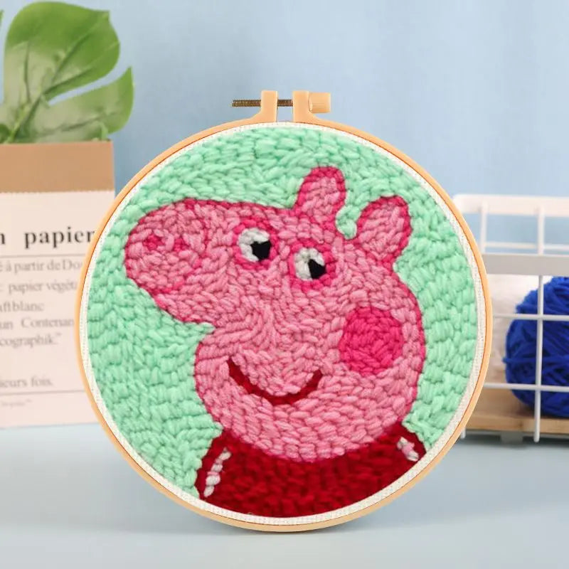 CraftHoop pink cartoon character embroidery on blue fabric - Cute and engaging DIY sewing kit