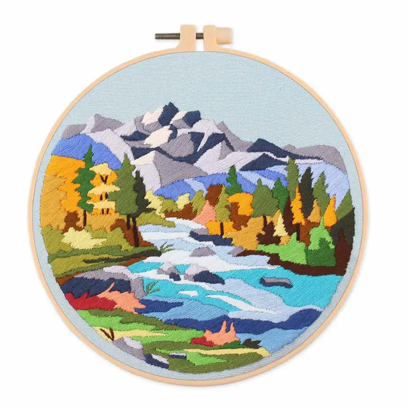 CraftHoop colorful village and mountain landscape embroidery - Whimsical and creative DIY project