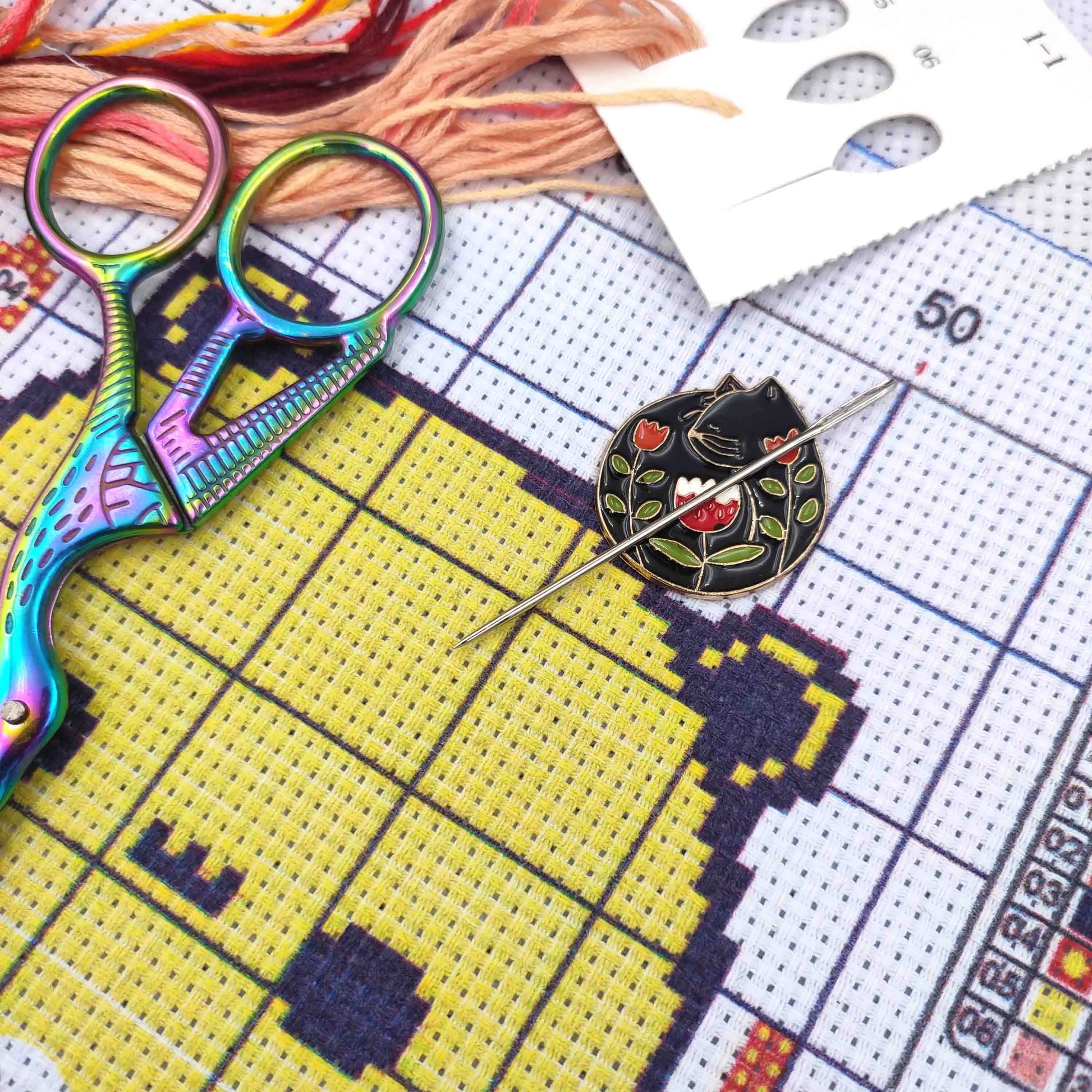 CraftHoop magnetic needle minder in use with colorful embroidery pattern - Essential accessory for needlework projects