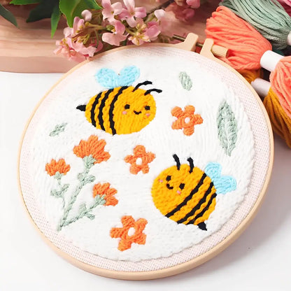 CraftHoop Buzz & Bloom Punch Needle Kit featuring cheerful bees and blooming flowers.