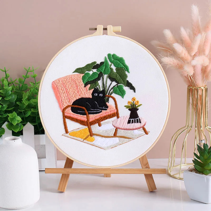 Embroidered CraftHoop Cat Lover's Home Kit hoop displayed on a wooden stand.