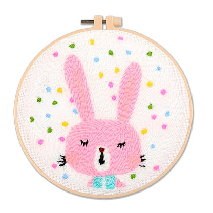 CraftHoop Garden Glow Punch Needle Kit featuring a playful pink bunny design with colorful confetti.
