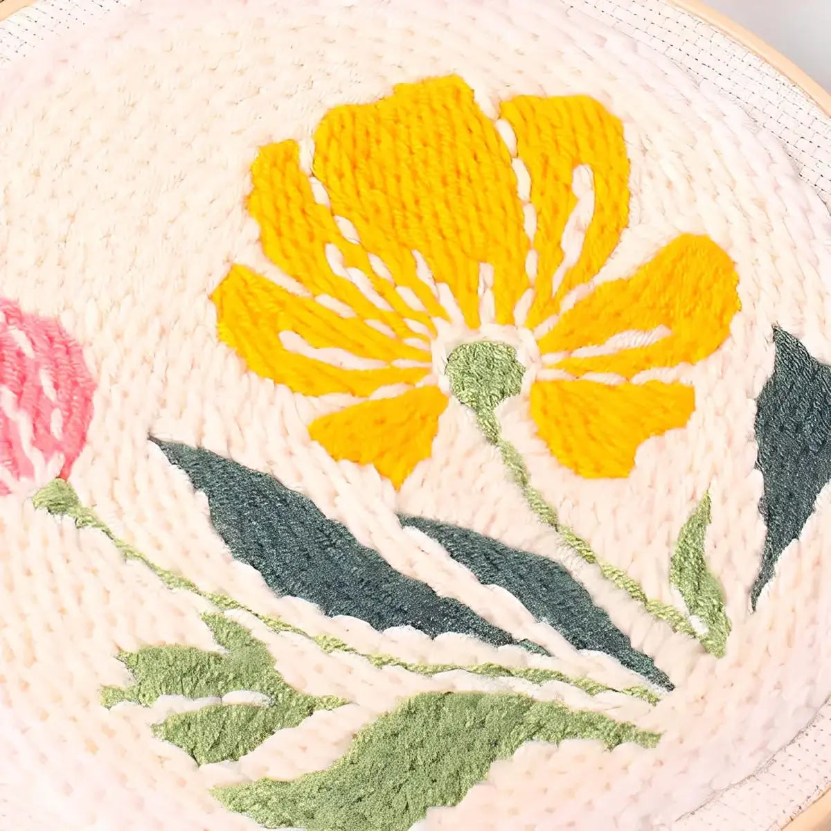 CraftHoop Garden Joy Punch Needle Kit floral design featuring vibrant yellow and pink flowers.