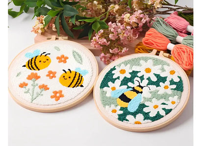 CraftHoop Buzz & Bloom Punch Needle Kit featuring cheerful bees and blooming flowers in embroidery hoops.