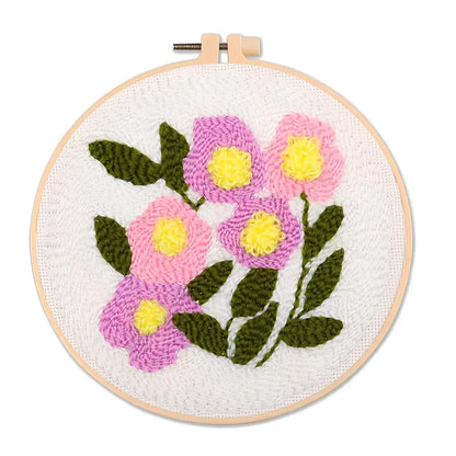 CraftHoop Garden Glow Punch Needle Kit with colorful floral embroidery design in a hoop.