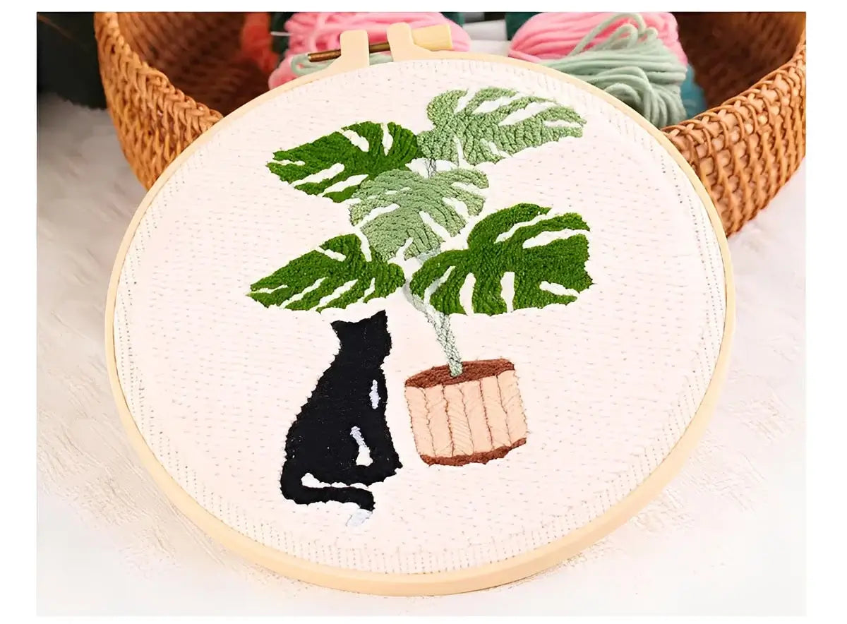 CraftHoop Cat & Plant Lovers Punch Needle Kit featuring a black cat and a lush houseplant in an embroidery hoop.