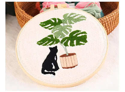 CraftHoop Cat & Plant Lovers Punch Needle Kit featuring a black cat and a lush houseplant in an embroidery hoop.