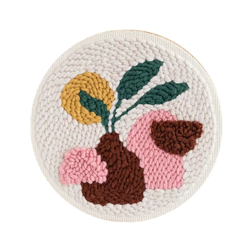 CraftHoop punch needle embroidery kit in progress, highlighting the detailed stitching of the leaf and abstract design.