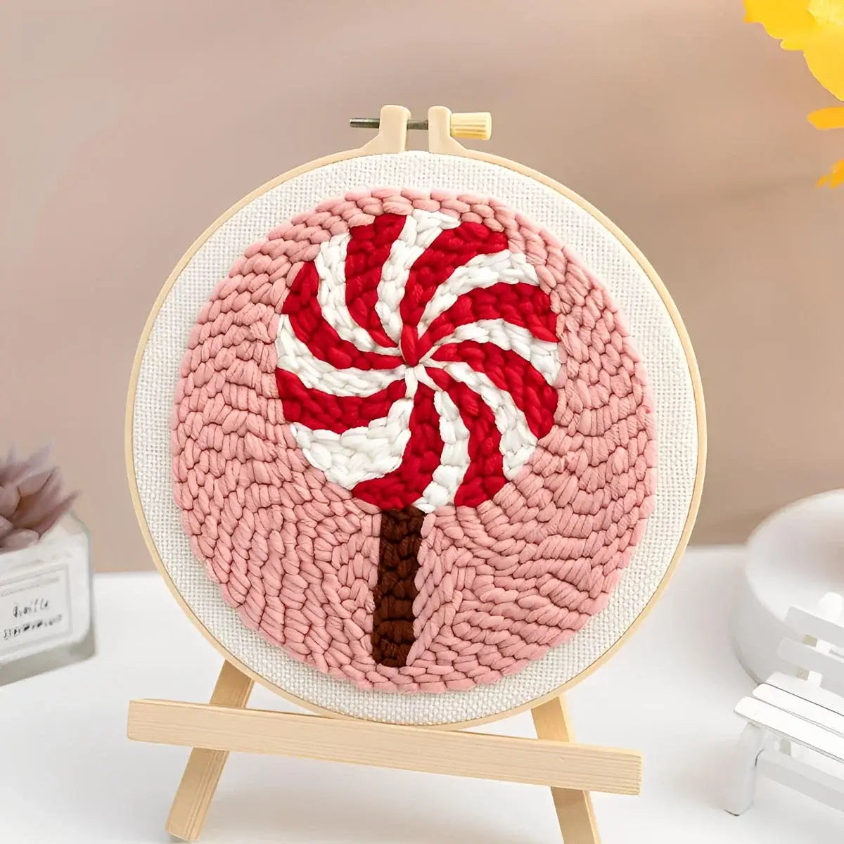 CraftHoop Christmas Cheer Punch Needle Kit candy cane design in a hoop display, perfect for holiday crafting.