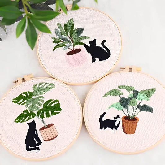 CraftHoop Cat & Plant Lovers Punch Needle Kit featuring embroidered cats and houseplants in charming designs.