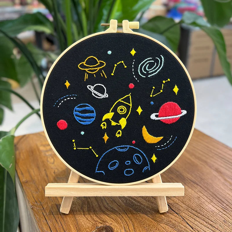 CraftHoop Little Astronaut Embroidery Kit on display, highlighting its celestial design with stars and the moon.