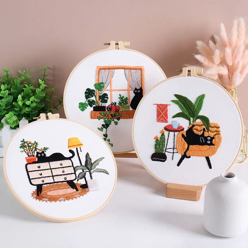 Collection of CraftHoop Cat Lover’s Home Embroidery Kit hoops displayed on a table.