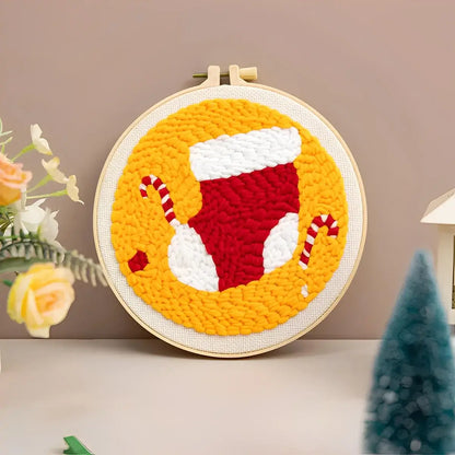 CraftHoop Christmas Cheer Punch Needle Kit festive stocking design with candy canes on a bright yellow background