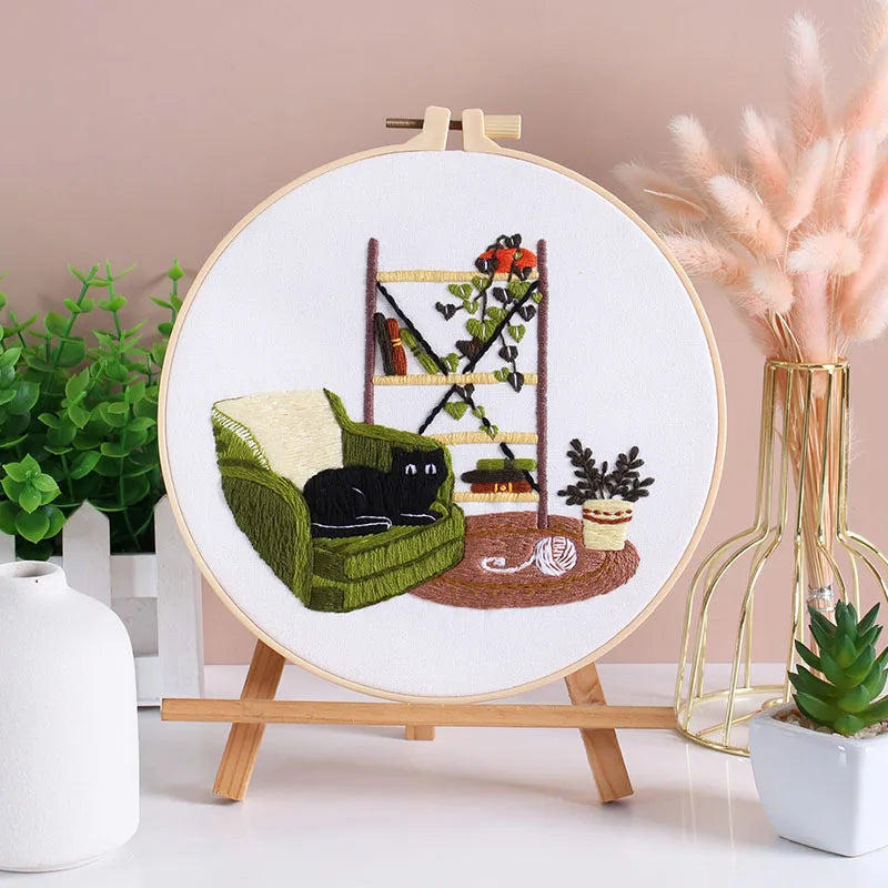 CraftHoop Cat Lover's Home Embroidery Kit with a completed hoop featuring a cat and plants.