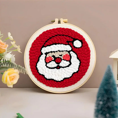 CraftHoop Christmas Cheer Punch Needle Kit featuring a festive Santa design in vibrant colors.