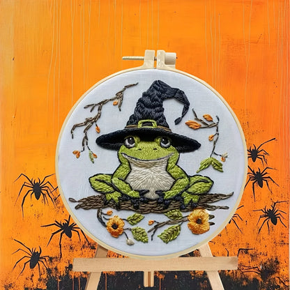 CraftHoop Crow Magic Halloween Embroidery Kit featuring a whimsical frog in a witch's hat and autumnal decor.