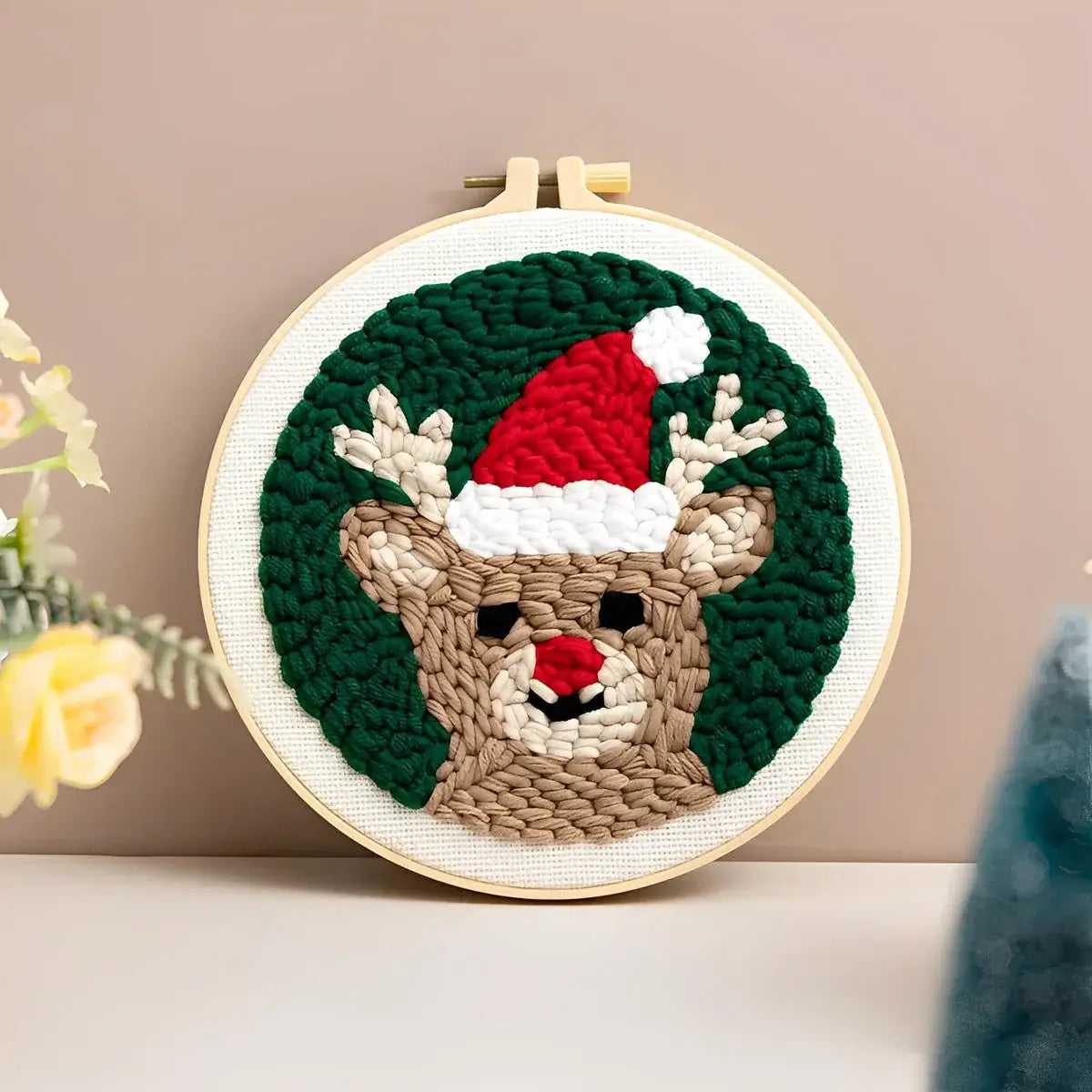 CraftHoop Christmas Cheer Punch Needle Kit festive reindeer design with a Santa hat and green background