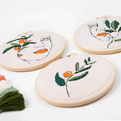 CraftHoop Botanical Muse Punch Needle Kit featuring embroidered abstract faces and botanical designs.