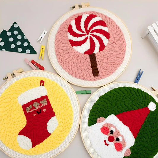 CraftHoop Christmas Cheer Punch Needle Kit designs featuring Santa, a stocking, and a candy cane in colorful embroidery.