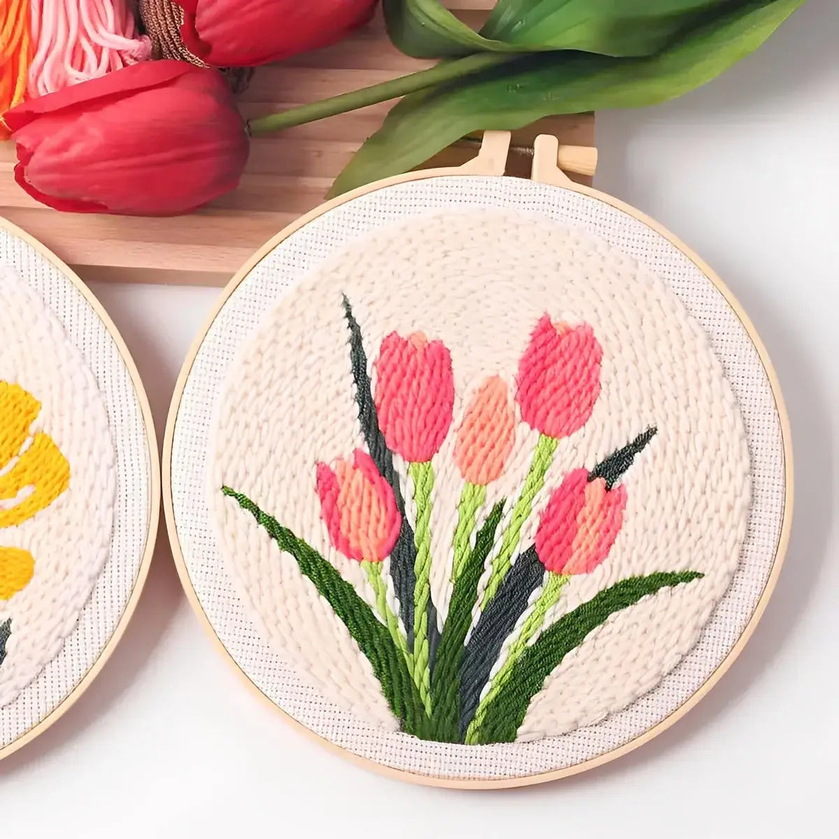 CraftHoop Garden Joy Punch Needle Kit featuring vibrant tulip designs in embroidery hoops.