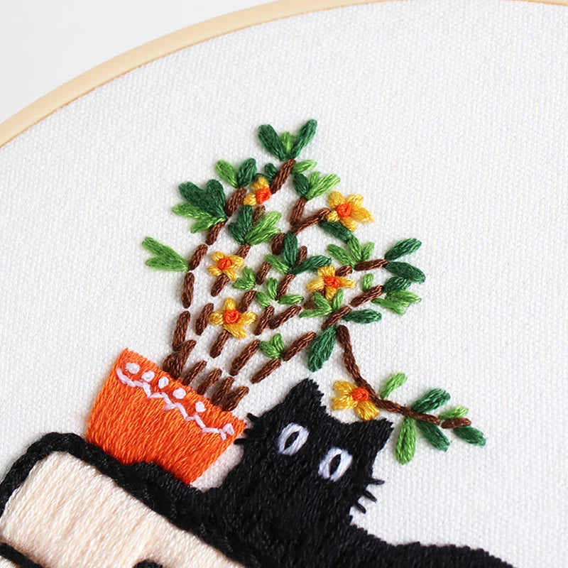 CraftHoop Cat Lover's Home Kit in progress, featuring a cat sitting by a plant.