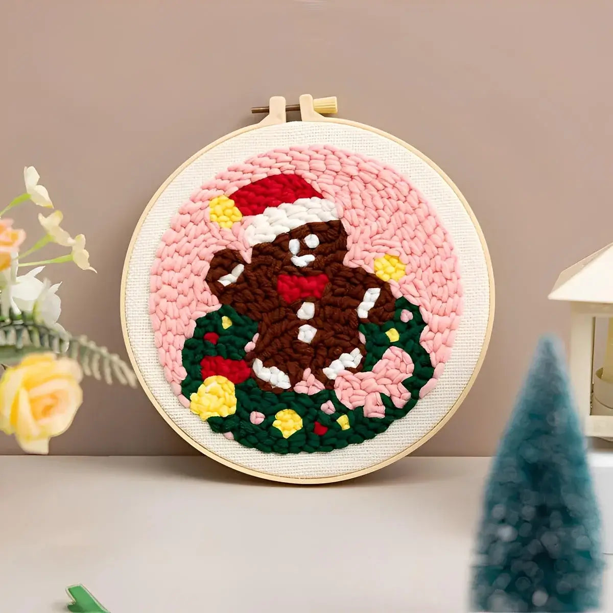 CraftHoop Christmas Cheer Punch Needle Kit featuring a festive gingerbread man design with Santa hat.