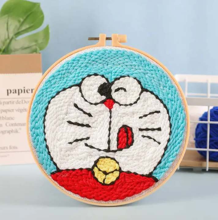 CraftHoop blue cartoon character embroidery on light fabric - Nostalgic and engaging DIY project