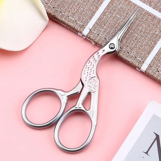 CraftHoop small embroidery scissors on pink fabric - Essential tool for detailed needlework