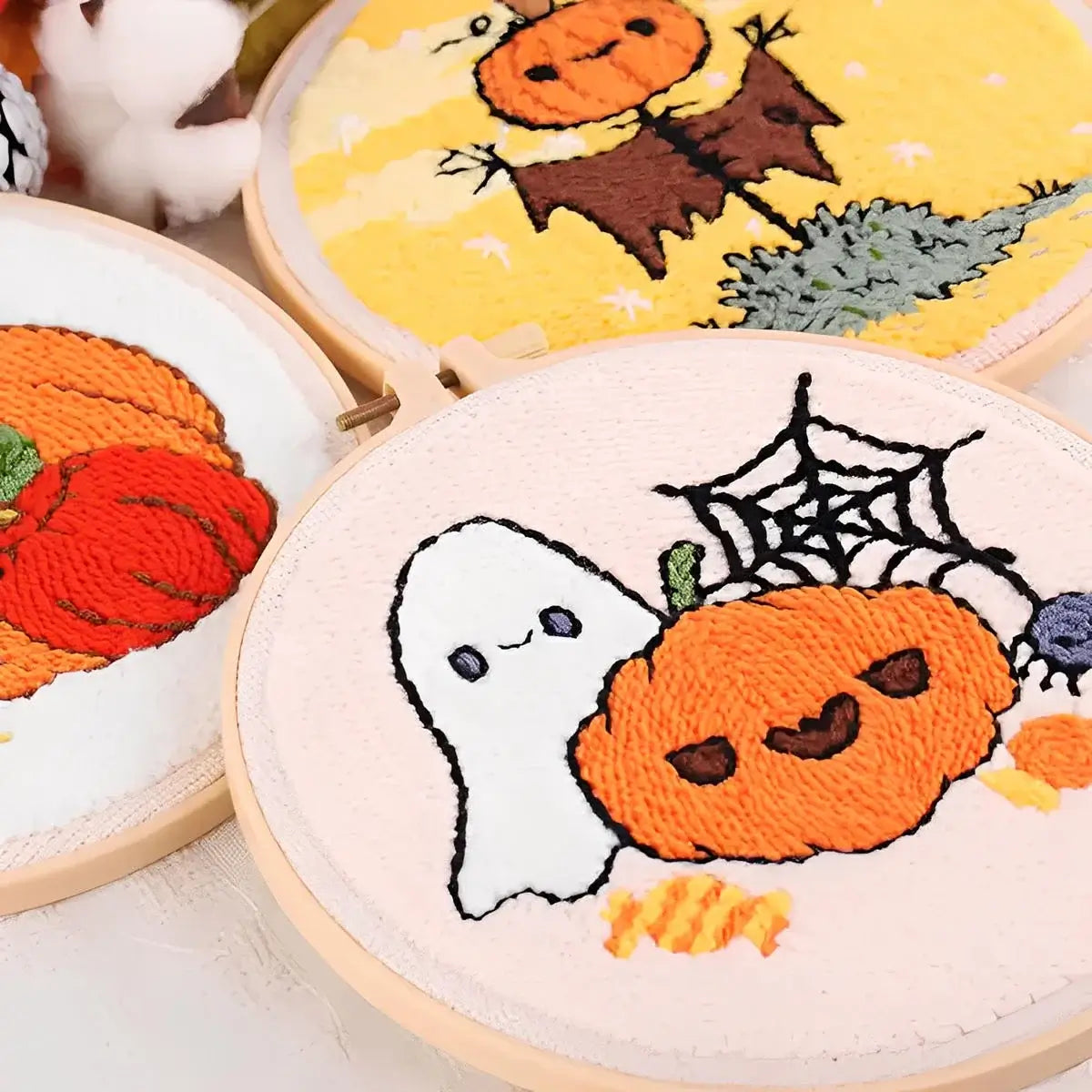 CraftHoop Pumpkin Halloween Punch Needle Kit showcasing playful designs with pumpkins, a ghost, and Halloween elements.