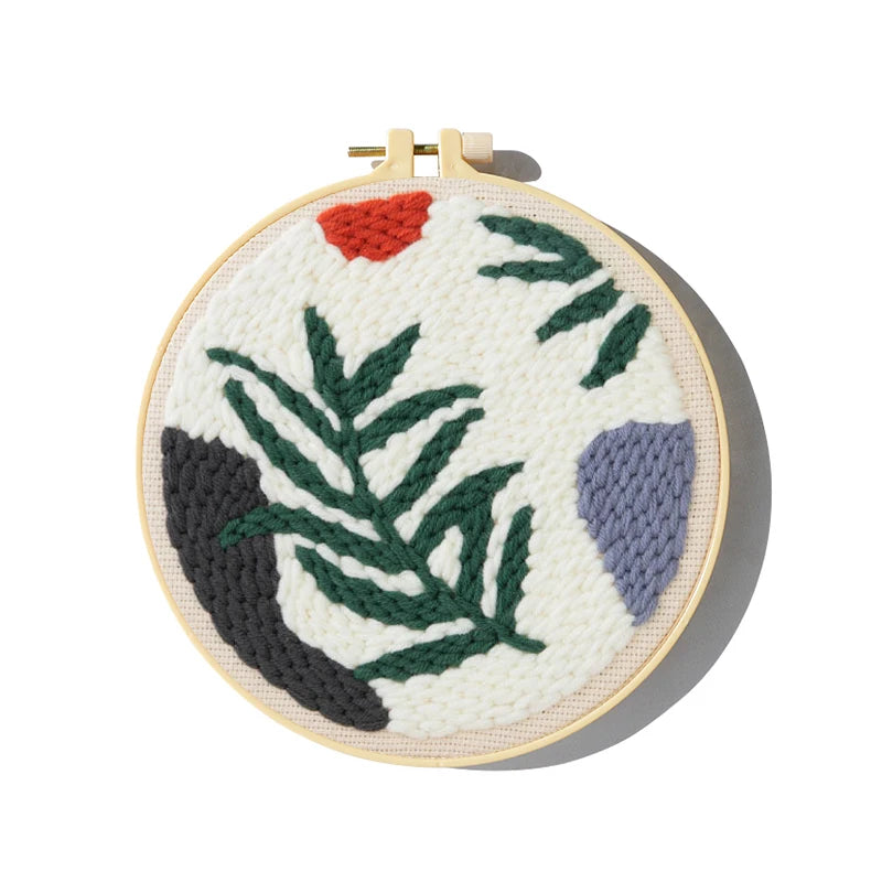 CraftHoop punch needle embroidery kit featuring a vibrant leaf design in progress, displayed on a white background.